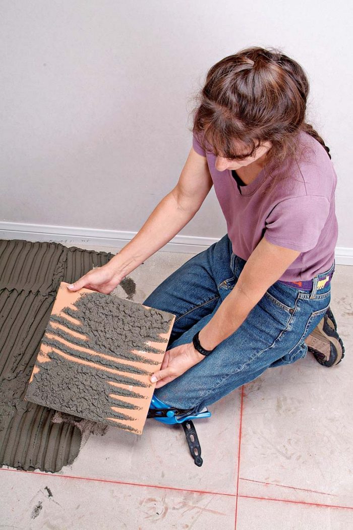 Uncoated areas on this tile show that it wasn’t properly bonded to the floor.