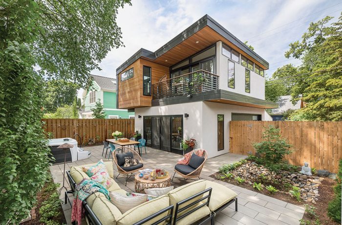 Exterior view of a two-story ADU with large outdoor space