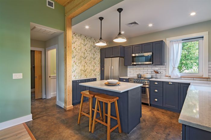 Kitchen with blue cabinetry and an island