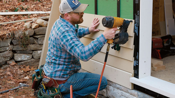 nailing new clapboard siding