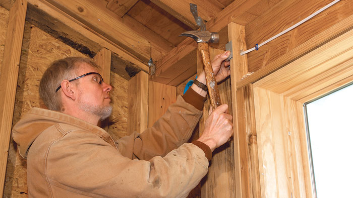 installing nail plate to protect wiring